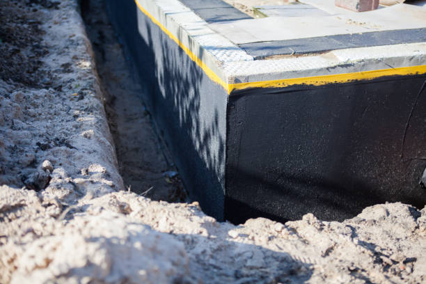 Professional Waterproofing technician working in Keego Harbor, MI